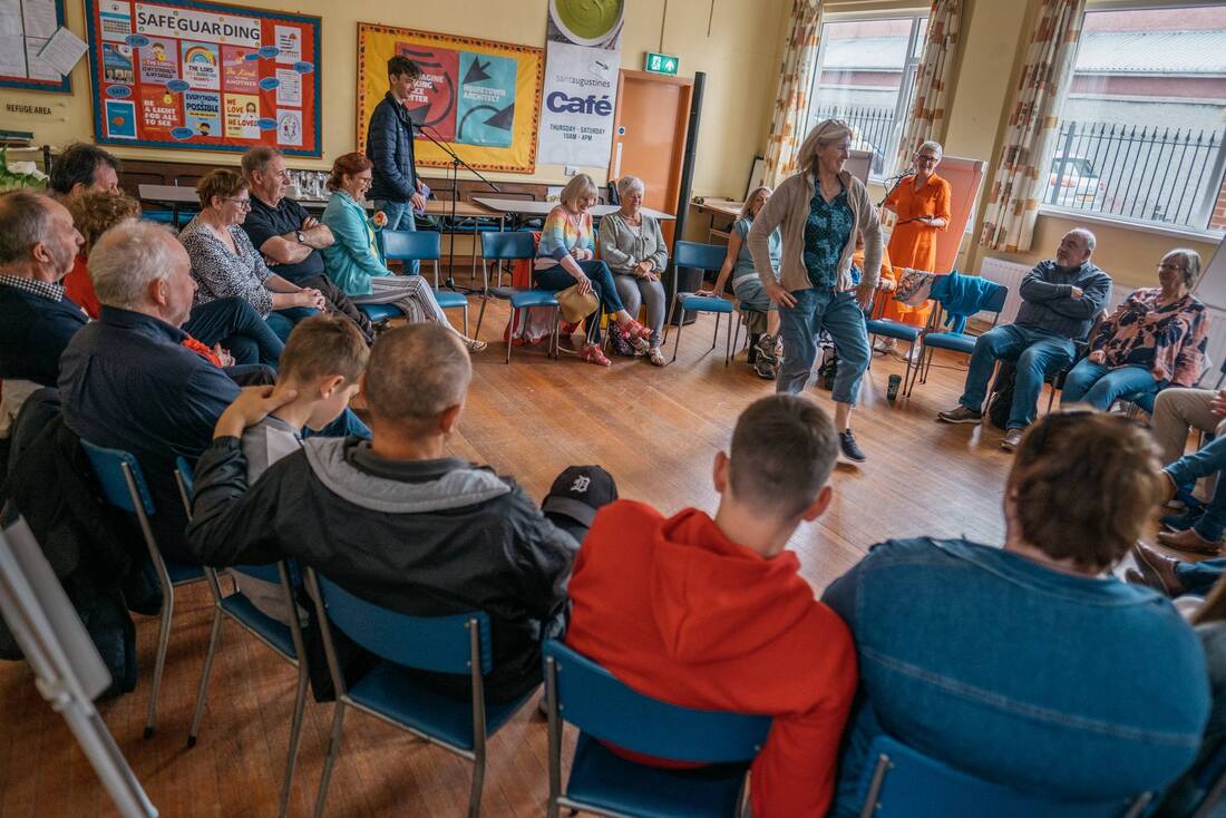 A wide angle shot of a the community members gathered to discuss the potential development of Moville as part of the Reimagine Moville project
