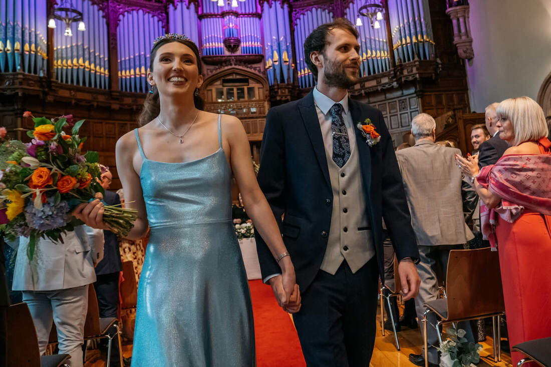 The newlyweds walking down the aisle at Guildhall, a celebratory moment captured by Patrick Duddy, before heading to the Bishops Gate Hotel in Derry.