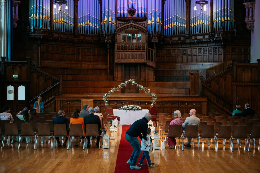 The stunning interior of Guildhall, with stain glassed windows and organ starting to fill with guests, a breathtaking scene captured by Patrick Duddy, before heading to the Bishops Gate Hotel for the celebration in Derry.