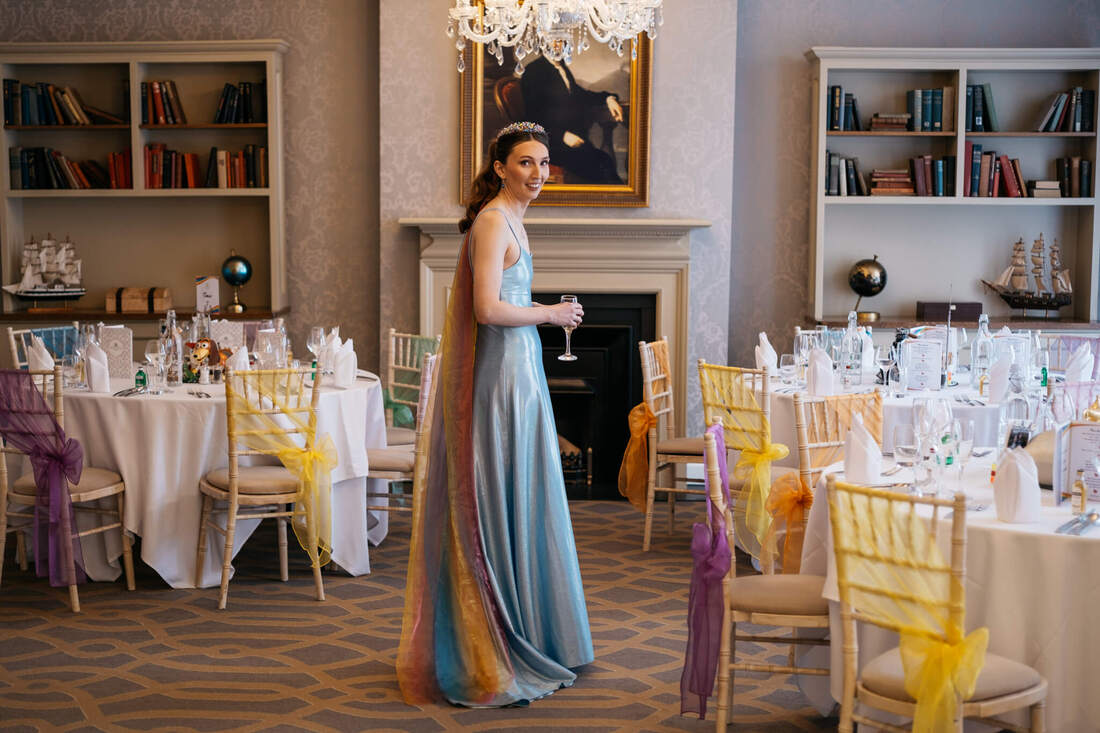 Bride looking  totally captivated by the elegant setting at Bishops Gate Hotel as they awaited the arrival of the Bride and Groom, fresh from their Guildhall wedding in Derry.